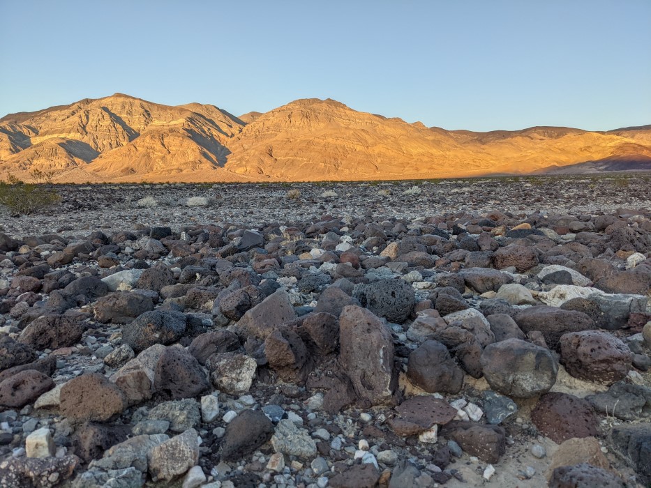 Same valley, but the ground has bigger, rocks, up to a few inches across, lining the ground.